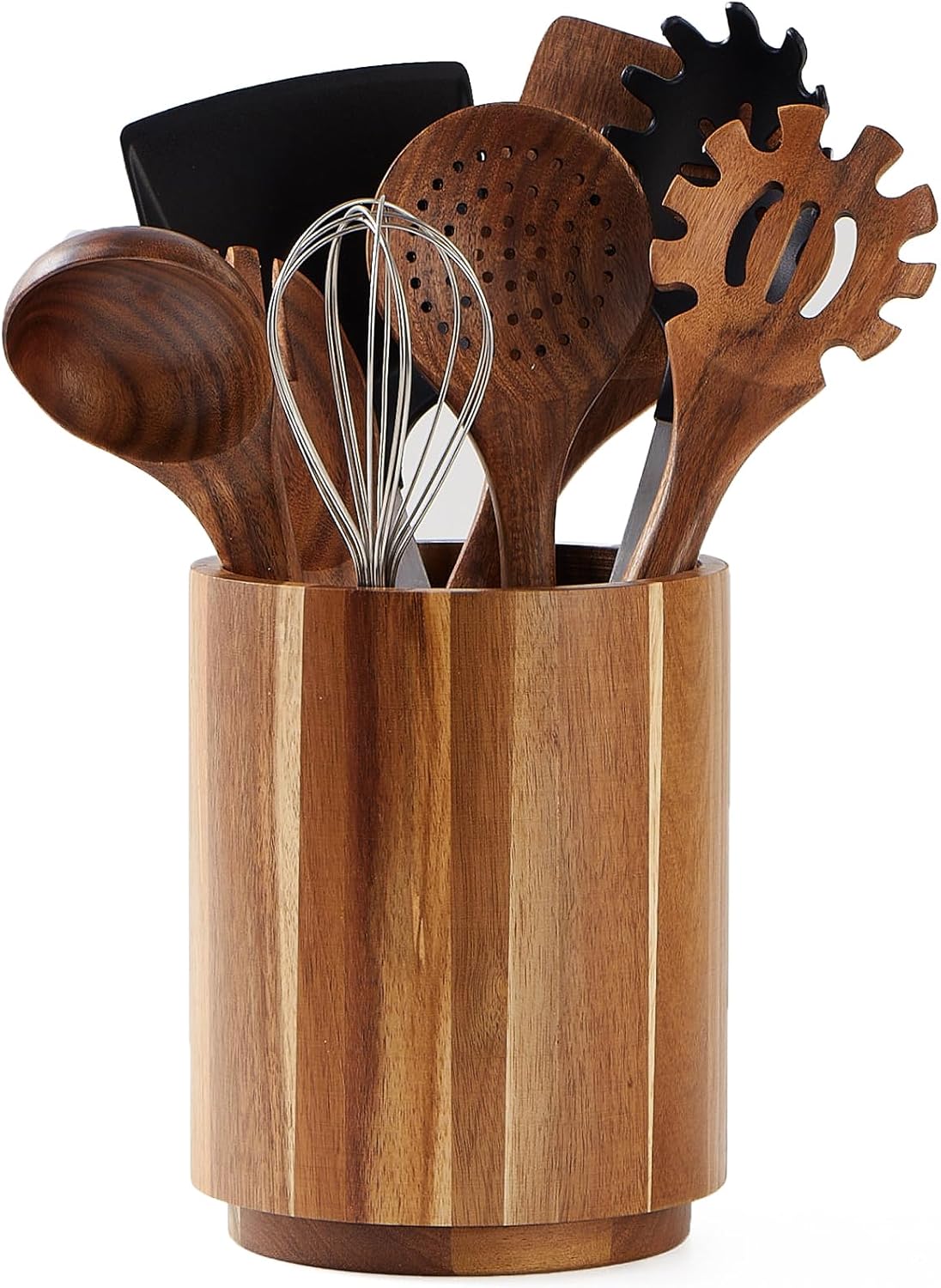 Wooden kitchen utensils in a wooden holder on a white background